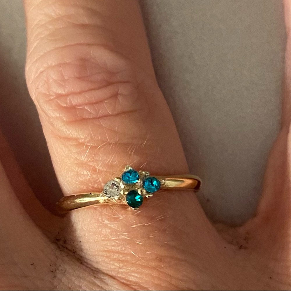 Dainty size 6 gold ring. Stones represent 2 December, 1 April, 1 May.
